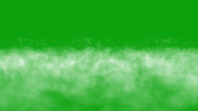 Smoke or fog moving on the ground, approaching fog on a green chrome key background, fog creeping along the floor and approaching the viewer, seamless loop of smoke. White smoke horizontal motion