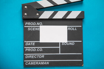 Black clapper board with a empty card.