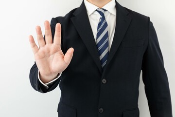 スーツ姿のビジネスマンポーズ ストップ
