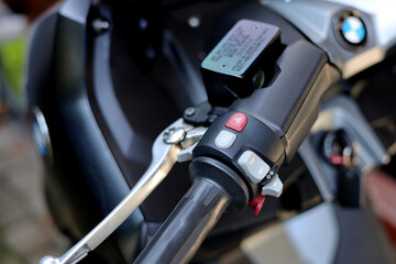 Fototapeta premium Left side of the motorbike handlebar closeup