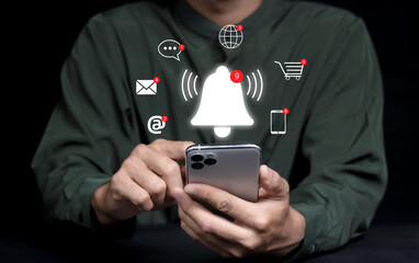 Businessman using smart phone with virtual bell ringing for application notification alert concept....