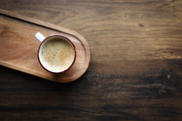 hot cup of coffee on wooden plate, flatlay, cozy autumn or winter holiday