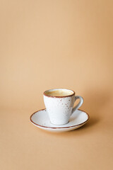 coffee cup with coffee beans on pastel background. flat lay, top view