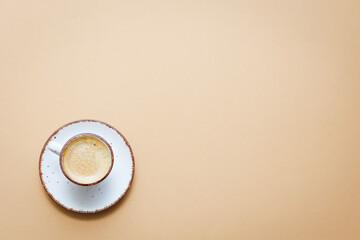 coffee cup with coffee beans on pastel background. flat lay, top view