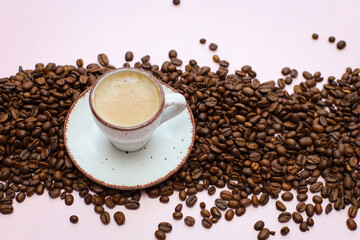 coffee cup with coffee beans on pastel background. flat lay, top view