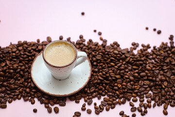 coffee cup with coffee beans on pastel background. flat lay, top view