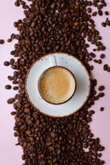 coffee cup with coffee beans on pastel background. flat lay, top view