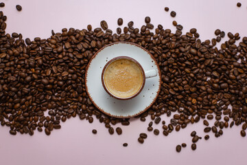 coffee cup with coffee beans on pastel background. flat lay, top view