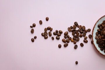 coffee cup with coffee beans on pastel background. flat lay, top view