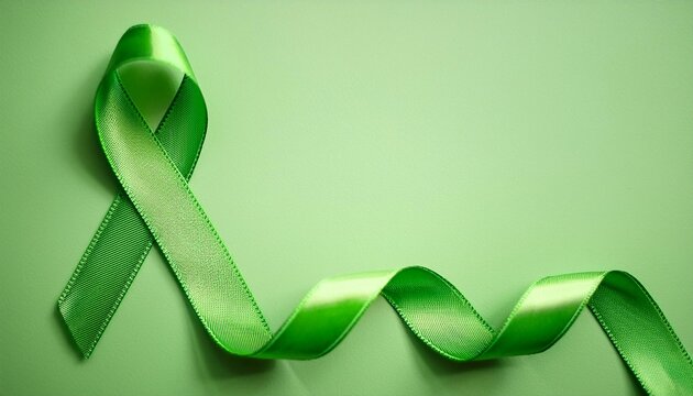 Lymphoma Awareness Symbol. Lime Green Ribbon with Copy Space for Text. Light Green Background Isolated. Flat Lay Top View.