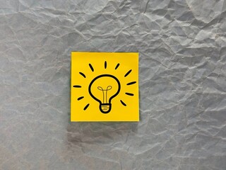 suggest an idea. an icon and a light bulb with the meaning of a new idea. business solutions.