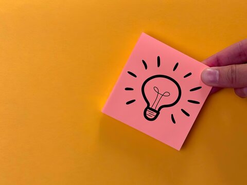 suggest an idea. an icon and a light bulb with the meaning of a new idea. business solutions.