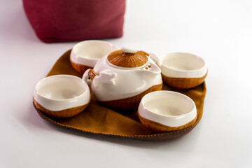 Tea set for making and drinking tea on a white background. Teapot and cups for tea. Tea drinking tradition