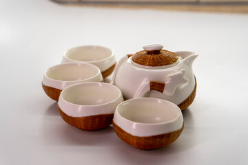 Tea set for making and drinking tea on a white background. Teapot and cups for tea. Tea drinking tradition