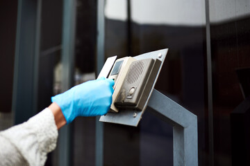 Access card, hygiene and security with hand of person at front door for safety, key scanning and digital lock. Entrance, health and property with closeup of scanner at office for keycard facility