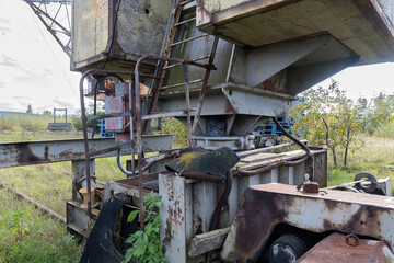 Abandoned Machinery in Overgrown Industrial Landscape
