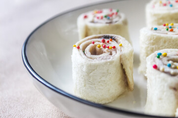 close up of some homemade fairy bread served in a bowl as a snack.