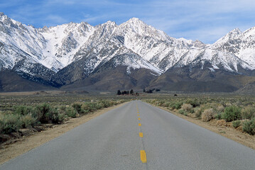 Fototapeta premium Road to Snow-Covered Mountains