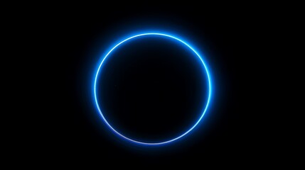Glowing blue circle on black background. Abstract design element.