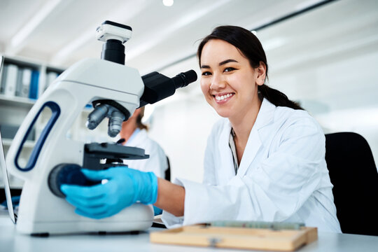 Happy woman, portrait and forensic scientist with microscope at lab for scientific research, test or discovery. Female person, microbiologist or smile with equipment for clinic trial, exam or results