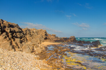 Ocean, Rocky Beach, and Breathtaking Mountain View