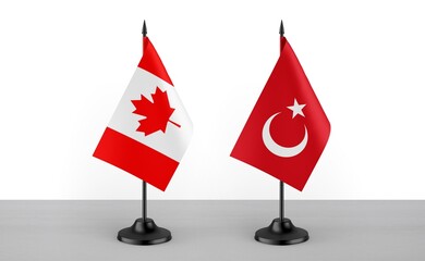 Image of the table flag of Canada and Turkey countries. White background. Close-up flags. High...