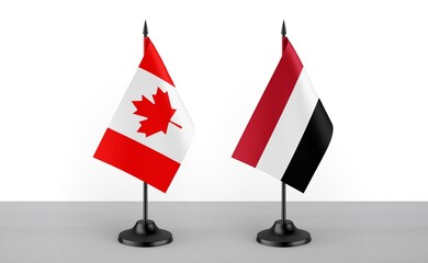Image of the table flag of Canada and Yemen countries. White background. Close-up flags. High...