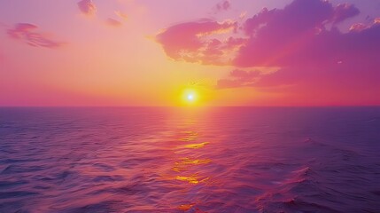 Obraz premium A vibrant watercolor of a sunset over the ocean, blending shades of orange, pink, and purple.