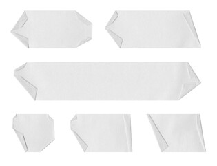 selection of white labels, banner, tags, stickers, torn, ripped, peeled, paper pieces, adhesive tape, masking tape, strips