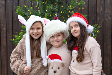 Children near the Christmas tree.