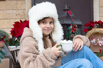 Portrait of a girl with a mug of hot chocolate.