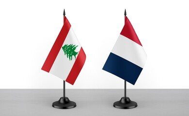 Image of the table flag of Lebanon and France countries. White background. Close-up flags. High...