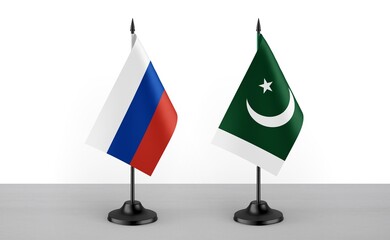 Image of the table flag of Russia and Pakistan countries. White background. Close-up flags. High...