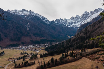 Aerial view of remote valley Val Saisera and alpine village Malborghetto Valbruna surrounded by...