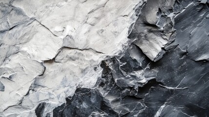 Natural rough stone texture with contrasting white and dark gray surfaces ideal for backgrounds in design and artistic projects.