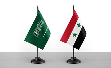 Image of the table flag of Saudi Arabia and Syria countries. White background. Close-up flags. High...