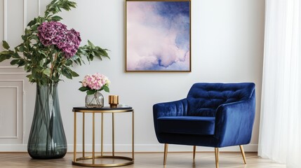 Elegant Scandinavian living room with navy blue velvet armchair, floral arrangements, and stylish decor featuring a mock-up poster frame.