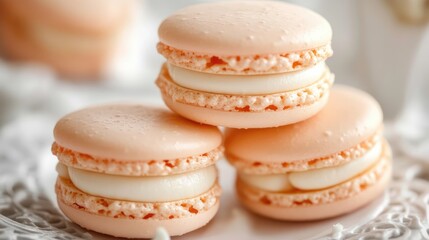 Fototapeta premium Pastel pink macarons stacked delicately on a decorative plate showcasing a gourmet dessert presentation