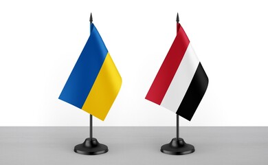 Image of the table flag of Ukraine and Yemen countries. White background. Close-up flags. High...