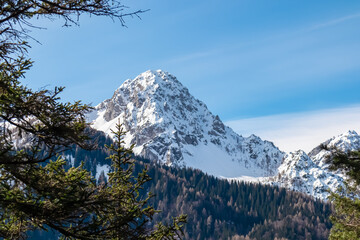 Panoramic view of snow capped mountain peak Jof di Miezegnot in pristine Julian Alps seen from...