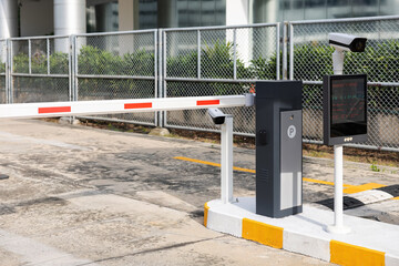 A parking meter with a camera on top of it. car park barrier, automatic entry system.