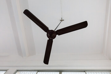 A fan is hanging from the ceiling