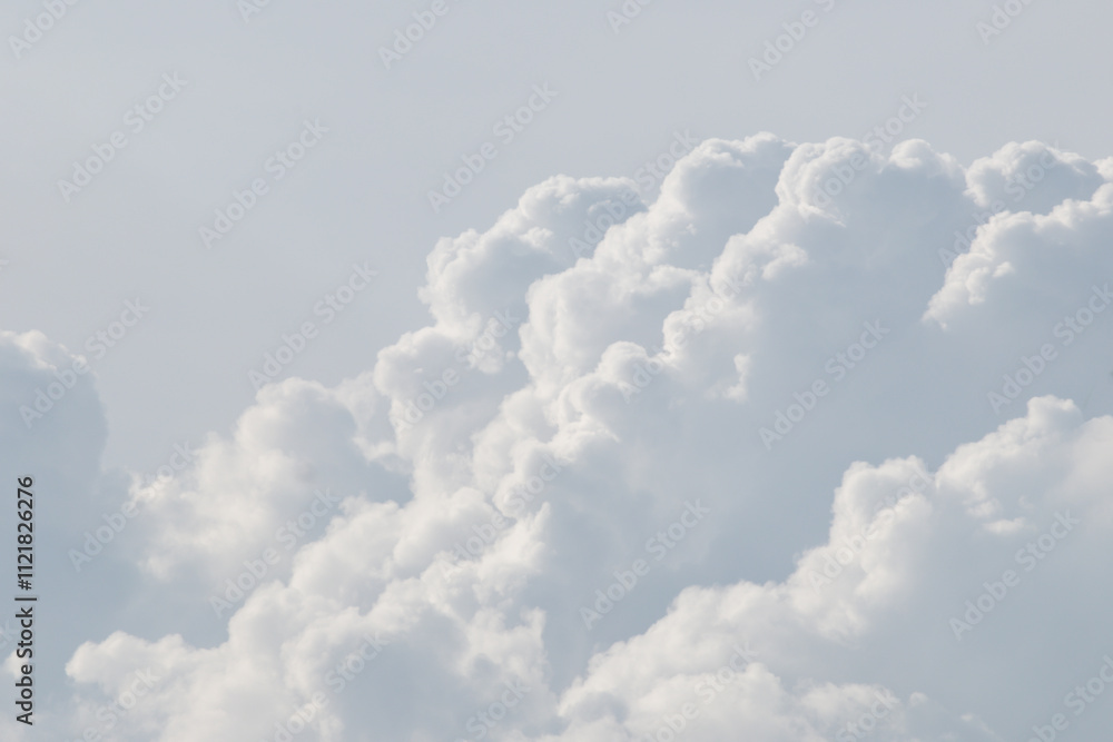 Wall mural white cloud background and texture. the sky is filled with fluffy white clouds, creating a serene.