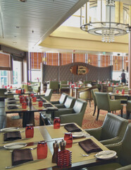 Formal and elegant ocean view Art Deco dining room restaurant onboard luxury cruiseship or cruise...