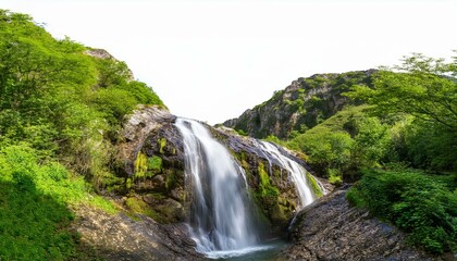 Obraz premium serene waterfall flowing through a mountainous landscape, featuring natural textures and vibrant greenery, isolated on a transparent background for creative projects