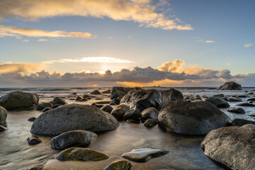 Obraz premium Stunning Sunset at the Coast – Long Exposure Capturing the Smooth Flow of Water and Vibrant Sky Colors, Creating a Peaceful and Serene Seaside Landscape Norway Norge - Jæren, jærstrendene