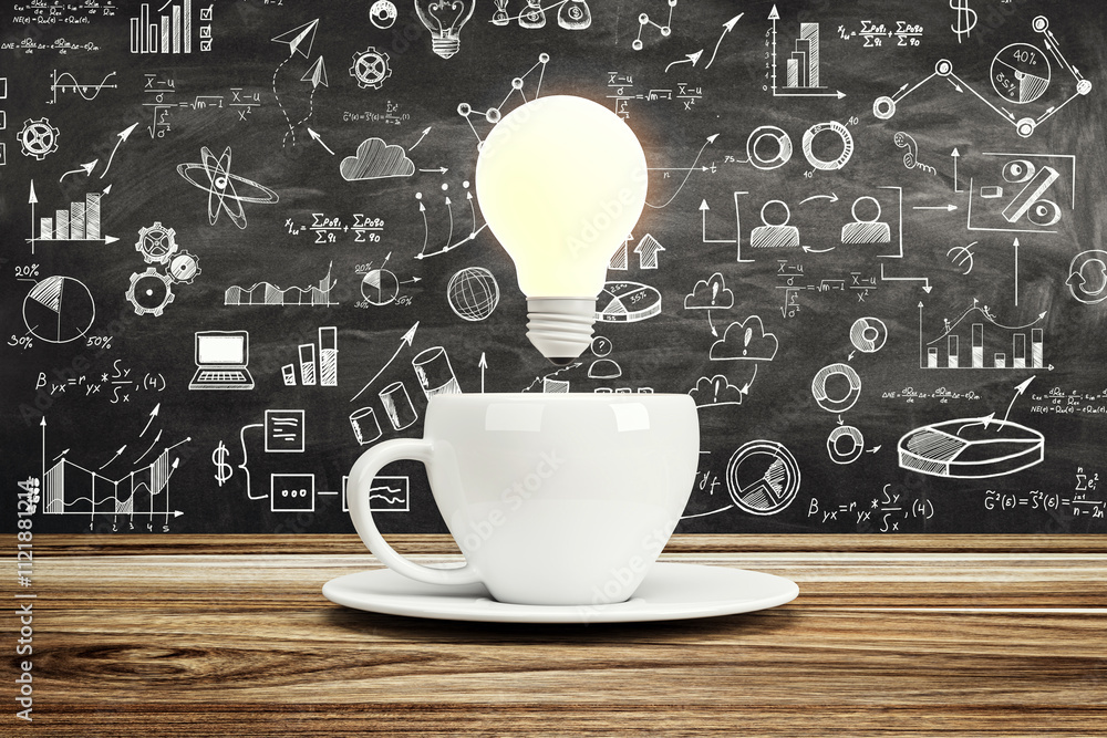 Poster white coffee cup with glowing lightbulb on wooden table against chalkboard background filled with sk