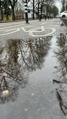 Fototapeta premium Bike path, autumn, puddle on the road