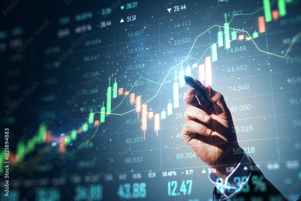 Fototapete hand analyzing digital financial data and stock market graph on futuristic screen.