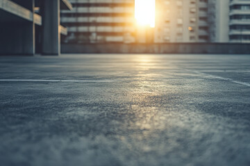 A sunset view from a concrete surface, highlighting urban architecture in the background.